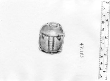  <em>Scarab</em>, ca. 1920 C.E. Faience, glaze, 7/8 × 1 1/2 × 1 15/16 in. (2.3 × 3.8 × 5 cm). Brooklyn Museum, Anonymous gift, 47.183. Creative Commons-BY (Photo: , CUR.47.183_NegA_print_bw.jpg)