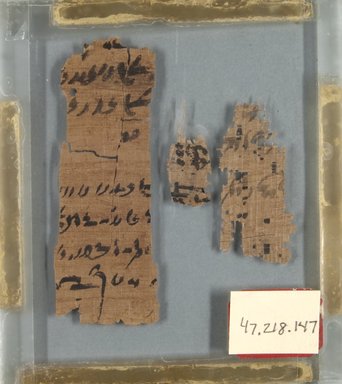 Demotic. <em>Papyrus Fragments Inscribed in Demotic</em>, 305-30 B.C.E.	. Papyrus, ink, Largest Fragment: 3 3/8 × 1 in. (8.5 × 2.5 cm). Brooklyn Museum, Bequest of Theodora Wilbour from the collection of her father, Charles Edwin Wilbour, 47.218.147 (Photo: Brooklyn Museum, CUR.47.218.147_front_IMLS_PS5.jpg)