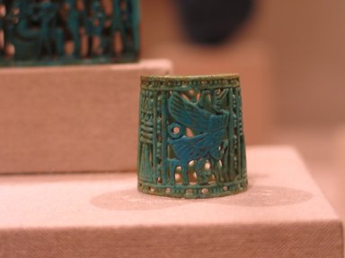  <em>Openwork Ring</em>, ca. 1070–718 B.C.E. Faience, 1 x 1 in. (2.6 x 2.6 cm). Brooklyn Museum, Charles Edwin Wilbour Fund, 48.203. Creative Commons-BY (Photo: Brooklyn Museum, CUR.48.203_wwg8.jpg)