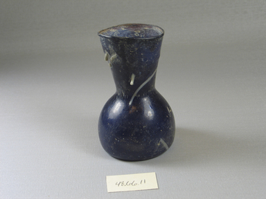 Egyptian. <em>Dark Blue Translucent Vessel</em>, 6th-8th century C.E. Glass, 3 7/8 x Diam. 2 7/16 in. (9.8 x 6.2 cm). Brooklyn Museum, Gift of Mrs. Lawrence Coolidge and Mrs. Robert Woods Bliss, and the Charles Edwin Wilbour Fund, 48.66.11. Creative Commons-BY (Photo: Brooklyn Museum, CUR.48.66.11_view2.jpg)
