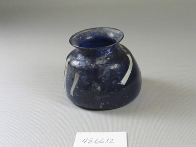 Egyptian. <em>Small Dark blue Translucent Vessel</em>, 6th-8th century C.E. Glass, 2 3/16 x Diam. 2 11/16 in. (5.5 x 6.8 cm). Brooklyn Museum, Gift of Mrs. Lawrence Coolidge and Mrs. Robert Woods Bliss, and the Charles Edwin Wilbour Fund, 48.66.12. Creative Commons-BY (Photo: Brooklyn Museum, CUR.48.66.12_view2.jpg)