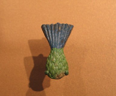  <em>Inlay in the Form of a Cornflower</em>, ca. 1390-1352 B.C.E. Faience, 1 5/8 x 1 x 1/4 in. (4.1 x 2.5 x 0.6 cm). Brooklyn Museum, Gift of Mrs. Lawrence Coolidge and Mrs. Robert Woods Bliss, and the Charles Edwin Wilbour Fund, 48.66.15. Creative Commons-BY (Photo: Brooklyn Museum, CUR.48.66.15_erg456.jpg)