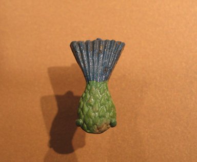  <em>Inlay in the Form of a Cornflower</em>, ca. 1390–1352 B.C.E. Faience, 1 5/8 x 1 x 1/4 in. (4.1 x 2.5 x 0.6 cm). Brooklyn Museum, Gift of Mrs. Lawrence Coolidge and Mrs. Robert Woods Bliss, and the Charles Edwin Wilbour Fund, 48.66.15. Creative Commons-BY (Photo: Brooklyn Museum, CUR.48.66.15_erg456.jpg)