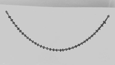  <em>Single Strand Necklace with Disk Beads</em>, ca. 1390-1352 B.C.E. Faience, 22 7/16 in. (57 cm). Brooklyn Museum, Gift of Mrs. Lawrence Coolidge and Mrs. Robert Woods Bliss, and the Charles Edwin Wilbour Fund, 48.66.55. Creative Commons-BY (Photo: Brooklyn Museum, CUR.48.66.55_NegL1009_13_print_bw.jpg)