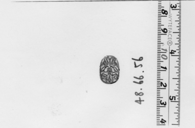  <em>Motto Scarab</em>, ca. 1630-1539 B.C.E. Steatite, glaze, 3/8 x 5/8 x 7/16 in. (1 x 1.6 x 1.1 cm). Brooklyn Museum, Gift of Mrs. Lawrence Coolidge and Mrs. Robert Woods Bliss, and the Charles Edwin Wilbour Fund, 48.66.56. Creative Commons-BY (Photo: , CUR.48.66.56_NegA_print_bw.jpg)