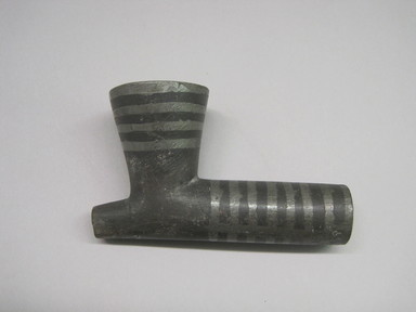 Sioux. <em>Inlaid Black Pipe Bowl</em>, early 19th century. Chlorite, metal, 3 × 2 × 5 in. (7.6 × 5.1 × 12.7 cm). Brooklyn Museum, Henry L. Batterman Fund and the Frank Sherman Benson Fund, 50.67.100a. Creative Commons-BY (Photo: , CUR.50.67.100a.jpg)