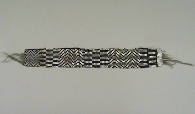 Chippewa (Anishinaabe). <em>Garter</em>, early 19th century. Yarn, garnet beads, pony beads, 11 3/4 x 1 11/16 in. (29.8 x 4.3 cm). Brooklyn Museum, Henry L. Batterman Fund and the Frank Sherman Benson Fund, 50.67.37a. Creative Commons-BY (Photo: Brooklyn Museum, CUR.50.67.37a.jpg)