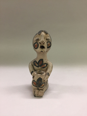 Tesuque. <em>Seated Figurine</em>, 20th century. Clay, slip, 6 7/8 × 2 3/4 × 3 1/4 in. (17.5 × 7 × 8.3 cm). Brooklyn Museum, Gift of Mary E. Johnson, 51.243.16. Creative Commons-BY (Photo: , CUR.51.243.16_view01.jpg)