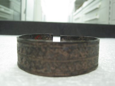Possibly Zulu. <em>Bracelet</em>, 19th century. Metal, 3/4 x 2 5/16 in. (1.9 x 5.9 cm). Brooklyn Museum, Bequest of Mrs. George Hadden, 52.80.5c. Creative Commons-BY (Photo: Brooklyn Museum, CUR.52.80.5c_side.jpg)