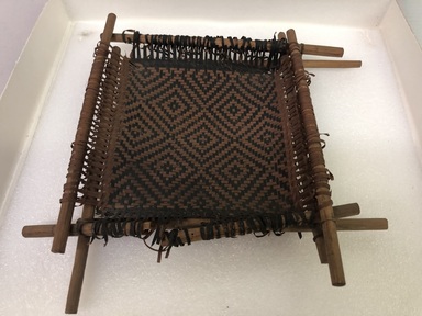  <em>A Square Strainer</em>, 20th century. Plant fiber, wood, 1 3/8 × 9 × 8 3/4 in. (3.5 × 22.9 × 22.2 cm). Brooklyn Museum, Gift of J. M. Levie, 53.217.4. Creative Commons-BY (Photo: Brooklyn Museum, CUR.53.217.4_view01.jpg)