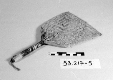  <em>A Paddle-Shaped Fan</em>. Fibers, 6 1/4 x 10 5/8 in. (15.8 x 27 cm). Brooklyn Museum, Gift of J. M. Levie, 53.217.5. Creative Commons-BY (Photo: Brooklyn Museum, CUR.53.217.5_bw.jpg)