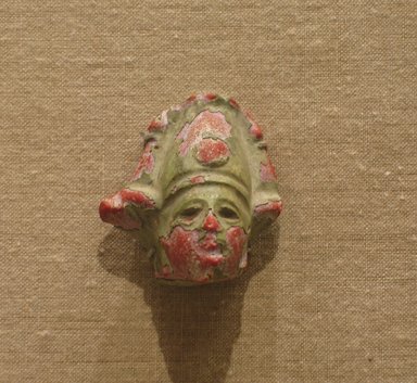  <em>Head of Osiris</em>, 305 B.C.E.-100 C.E. Glass, 1 9/16 in. (3.9 cm). Brooklyn Museum, Charles Edwin Wilbour Fund, 53.86. Creative Commons-BY (Photo: Brooklyn Museum, CUR.53.86_wwg8.jpg)