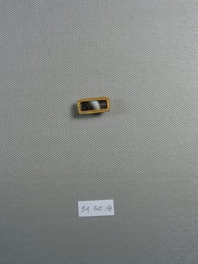  <em>One of Five Rectangular Stones</em>, ca. 410 B.C.E. Gold, agate, 3/8 x 1/4 x 13/16 in. (1 x 0.7 x 2.1 cm). Brooklyn Museum, Charles Edwin Wilbour Fund, 54.50.18. Creative Commons-BY (Photo: Brooklyn Museum, CUR.54.50.18_view1.jpg)