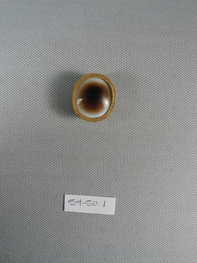  <em>One of Fifteen Circular Stones</em>, 5th-4th century B.C.E. Gold, agate, 15/16 x 9/16 x Diam 1 1/16 in. (2.4 x 1.4 x Diam 2.7 cm). Brooklyn Museum, Charles Edwin Wilbour Fund, 54.50.1. Creative Commons-BY (Photo: Brooklyn Museum, CUR.54.50.1_view1.jpg)