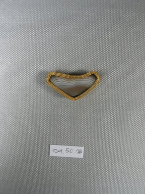  <em>One of Eleven Triangular Stones</em>, ca. 410 B.C.E. Gold, agate, 5/8 x 3/16 x 1 3/8 in. (1.6 x 0.6 x 3.6 cm). Brooklyn Museum, Charles Edwin Wilbour Fund, 54.50.26. Creative Commons-BY (Photo: Brooklyn Museum, CUR.54.50.26_view1.jpg)