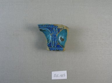  <em>Fragment of Inkwell?</em>, 664–30 B.C.E. Faience, 1 x 1 7/16 x 1 13/16 in. (2.5 x 3.7 x 4.6 cm). Brooklyn Museum, Gift of Michel Abemayor, 55.185. Creative Commons-BY (Photo: Brooklyn Museum, CUR.55.185_view1.jpg)