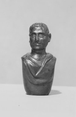  <em>Bust of a Man</em>, late 1st century B.C.E. Hematite, Height: 1 7/8 in. (4.8 cm). Brooklyn Museum, Charles Edwin Wilbour Fund, 56.18. Creative Commons-BY (Photo: Brooklyn Museum, CUR.56.18_NegC_print_bw.jpg)