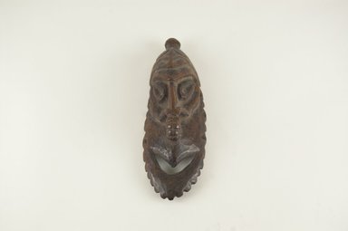  <em>Carved Mask</em>. Wood, 6 1/4 x 1 15/16 in.  (15.8 x 5.0 cm). Brooklyn Museum, Gift of Arturo and Paul Peralta-Ramos, 56.6.13. Creative Commons-BY (Photo: Brooklyn Museum, CUR.56.6.13_PS5.jpg)