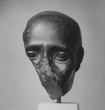  <em>Fragment of a Head with Shaven Skull</em>, 4th–3rd century B.C.E. Basalt, 5 3/8 × 4 3/4 × 2 3/8 in. (13.7 × 12.1 × 6 cm). Brooklyn Museum, Charles Edwin Wilbour Fund, 57.42. Creative Commons-BY (Photo: , CUR.57.42_NegA_print_bw.jpg)