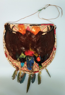  <em>Gorget</em>, 20th century. Bark cloth, seeds, feathers, whole birds, pigment, plant fiber, 15 1/4 × 1 1/2 × 18 11/16 in. (38.7 × 3.8 × 47.5 cm). Brooklyn Museum, Gift of George Grossblatt, 58.159.1. Creative Commons-BY (Photo: Brooklyn Museum, CUR.58.159.1.jpg)