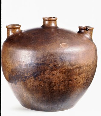 Charles Graham Chemical Pottery Works (1878-ca. 1913). <em>Yeast Jar</em>, late 19th century. Earthenware, 13 3/16 × 15 in. (33.5 × 38.1 cm). Brooklyn Museum, Gift of the Jerome Levy Foundation, 58.3. Creative Commons-BY (Photo: Brooklyn Museum, CUR.58.3.jpg)