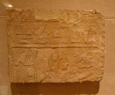  <em>Raised Relief of a Priest</em>, ca. 664–610 B.C.E. Limestone, 11 5/16 x 14 3/4 in. (28.8 x 37.5 cm). Brooklyn Museum, Charles Edwin Wilbour Fund, 61.165. Creative Commons-BY (Photo: Brooklyn Museum, CUR.61.165_wwg8.jpg)