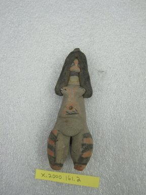 Karaja. <em>Standing Female Figurine</em>, ca. mid-20th century. Ceramic, pigment, cotton, 4 1/2 x 1 1/2 x 1 in. (11.4 x 3.8 x 2.5 cm). Brooklyn Museum, Gift of Ingeborg de Beausacq, 62.180.13. Creative Commons-BY (Photo: Brooklyn Museum, CUR.62.180.13_front.jpg)