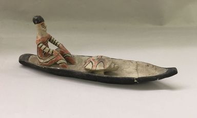 Karaja. <em>Figurine Seated in Canoe with Turtle</em>, mid-20th century. Ceramic, pigment, 11 3/16 x 4 1/4 x 2 1/2 in. (28.4 x 10.8 x 6.4 cm). Brooklyn Museum, Gift of Ingeborg de Beausacq, 62.180.19. Creative Commons-BY (Photo: Brooklyn Museum, CUR.62.180.19_view01.jpg)