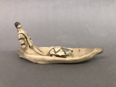 Karaja. <em>Figurine Seated in Canoe with Turtle</em>, ca. mid-20th century. Ceramic, pigment, 7 11/16 x 2 9/16 x 3 3/4 in. (19.5 x 6.5 x 9.5 cm). Brooklyn Museum, Gift of Ingeborg de Beausacq, 62.180.24. Creative Commons-BY (Photo: Brooklyn Museum, CUR.62.180.24_view01.jpg)