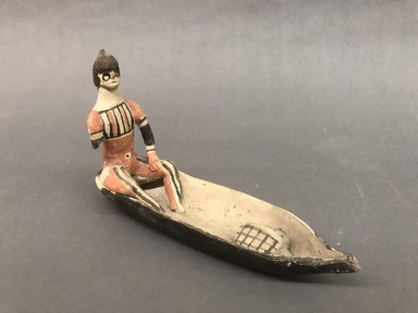 Karaja. <em>Figurine Seated in Canoe with Turtle</em>, ca. mid 20th century. Ceramic, pigment, 9 3/16 x 5 3/4 x 2 3/8 in. (23.3 x 14.6 x 6 cm). Brooklyn Museum, Gift of Ingeborg de Beausacq, 62.180.26. Creative Commons-BY (Photo: Brooklyn Museum, CUR.62.180.26_view01.jpg)