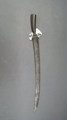  <em>Kris With Wooden Handle and Brass Guard</em>. Iron, wood, brass, 2 3/8 x 19 7/8 in. (6 x 50.5 cm). Brooklyn Museum, Gift of Mr. and Mrs. Emanuel H. Lavine, 62.4.1. Creative Commons-BY (Photo: Brooklyn Museum, CUR.62.4.1.jpg)