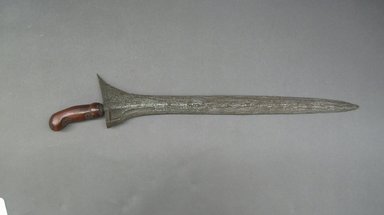 <em>Kris</em>. Iron, wood, 3 1/8 x 18 1/8 in. (8 x 46 cm). Brooklyn Museum, Gift of Mr. and Mrs. Emanuel H. Lavine, 62.4.4. Creative Commons-BY (Photo: Brooklyn Museum, CUR.62.4.4.jpg)