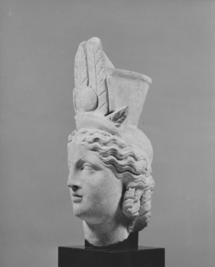  <em>Head of Isis-Fortuna</em>, 1st century B.C.E.- 2nd century C.E. Marble, 14 x 8 7/16 x 5 1/2 in. (35.5 x 21.5 x 14 cm). Brooklyn Museum, Charles Edwin Wilbour Fund, 62.45. Creative Commons-BY (Photo: Brooklyn Museum, CUR.62.45_NegB_print_bw.jpg)