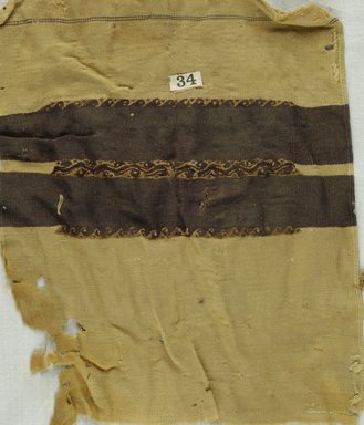 Coptic. <em>Tunic Fragment with Band Decoration</em>, 5th-7th century C.E. Wool, 9 1/2 x 11 3/4 in. (24.1 x 29.8 cm). Brooklyn Museum, Gift of Adelaide Goan, 64.114.238 (Photo: Brooklyn Museum (in collaboration with Index of Christian Art, Princeton University), CUR.64.114.238_ICA.jpg)