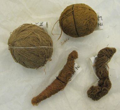  <em>4 Balls of Yarn</em>, n.d. Cotton, camelid fiber, Largest ball: 1 1/2 x 1 1/8 x 1 3/4 in. (3.8 x 2.9 x 4.4 cm). Brooklyn Museum, Gift of Adelaide Goan, 64.114.82a-d (Photo: Brooklyn Museum, CUR.64.114.82a-d.jpg)