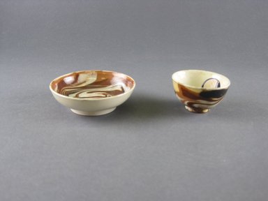 Attributed to Thomas Whieldon (1719-1795). <em>Miniature Tea Cup and Saucer</em>, ca. 1750. Earthenware, Marbleized ware, Cup: 1 1/16 x 1 7/8 in. (2.7 x 4.8 cm). Brooklyn Museum, Gift of the Estate of Emily Winthrop Miles, 64.195.14a-b. Creative Commons-BY (Photo: Brooklyn Museum, CUR.64.195.14a-b_view1.jpg)