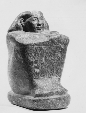 Egyptian. <em>Temple Block Statue of a Man Connected to the Estate of a God's Wife of Amun</em>, ca. 775-653 B.C.E. Diorite, 9 3/16 x 5 5/16 x 6 5/16 in. (23.4 x 13.5 x 16 cm). Brooklyn Museum, Charles Edwin Wilbour Fund, 64.200.1. Creative Commons-BY (Photo: , CUR.64.200.1_NegF_print_bw.jpg)