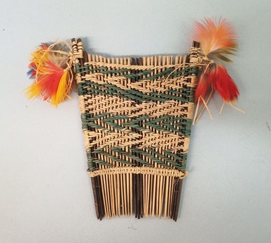 Possibly Tapirape. <em>Comb</em>, 20th century. Cane, cotton, feathers, 5 × 9 3/8 × 1/2 in. (12.7 × 23.8 × 1.3 cm). Brooklyn Museum, A. Augustus Healy Fund, 64.214.21. Creative Commons-BY (Photo: Brooklyn Museum, CUR.64.214.21.jpg)