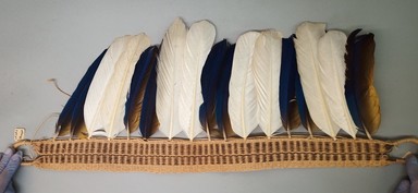  <em>Belt</em>, 20th century. Fiber, feathers, 11 × 2 7/16 × 27 1/2 in. (27.9 × 6.2 × 69.9 cm). Brooklyn Museum, A. Augustus Healy Fund, 64.214.6. Creative Commons-BY (Photo: Brooklyn Museum, CUR.64.214.6.jpg)