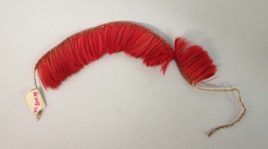 Kaapor. <em>Bracelet</em>, 20th century. Feathers, plant fiber, 13/16 × 3/8 × 4 3/4 in. (2.1 × 1 × 12.1 cm), not including ties. Brooklyn Museum, Gift of Ingeborg de Beausacq, 64.248.12. Creative Commons-BY (Photo: Brooklyn Museum, CUR.64.248.12.jpg)