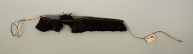 Kaapor. <em>Bracelet</em>, 20th century. Feathers, plant fiber, 1 1/16 × 1/2 × 5 1/4 in. (2.7 × 1.3 × 13.3 cm), not including ties. Brooklyn Museum, Gift of Ingeborg de Beausacq, 64.248.19. Creative Commons-BY (Photo: Brooklyn Museum, CUR.64.248.19.jpg)