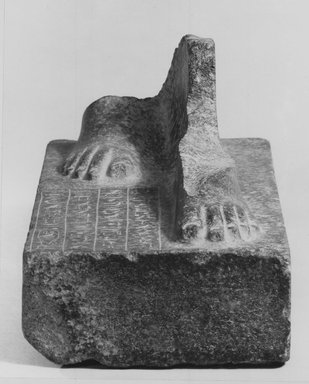 <em>Statue Base</em>. Granite, 6 1/2 x 3 3/4 in. (16.5 x 9.6 cm). Brooklyn Museum, Charles Edwin Wilbour Fund, 65.47. Creative Commons-BY (Photo: Brooklyn Museum, CUR.65.47_negA_bw.jpg)