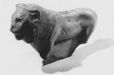  <em>Statuette of a Striding Lion</em>, 4th to 3rd century B.C.E. (probably). Faience, 2 1/16 x 1 3/16 x 3 5/8 in. (5.2 x 3 x 9.2 cm). Brooklyn Museum, Charles Edwin Wilbour Fund, 66.173. Creative Commons-BY (Photo: Brooklyn Museum, CUR.66.173_NegA_print_bw.jpg)