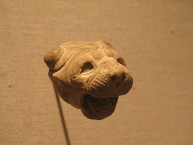  <em>Head of a Lion</em>, ca. 525-404 B.C.E. Stucco, 2 3/16 x 2 3/16 x 1 3/4 in. (5.6 x 5.5 x 4.4 cm). Brooklyn Museum, Charles Edwin Wilbour Fund, 66.176. Creative Commons-BY (Photo: Brooklyn Museum, CUR.66.176_wwg8.jpg)