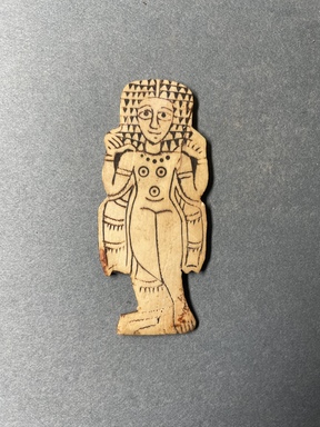 Nubian. <em>Inlay in the Form of a Woman</em>, 350–450 C.E. Ivory, 3 1/8 × 1 5/16 × 1/8 in. (7.9 × 3.4 × 0.3 cm). Brooklyn Museum, Charles Edwin Wilbour Fund, 66.66.2. Creative Commons-BY (Photo: Brooklyn Museum, CUR.66.66.2_overall.JPG)