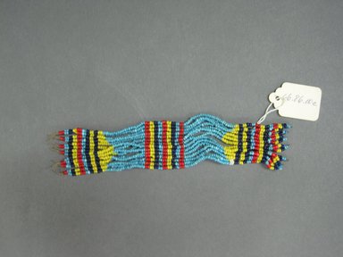 Possibly Zulu. <em>Ankle or Wrist Cuffs</em>, mid-20th century. Glass seed beads, natural fiber, a: 6 1/2 x 1 1/2 in. (16.5 x 3.8 cm). Brooklyn Museum, Gift of Mr. and Mrs. Jerome Blum, 66.86.10a-d. Creative Commons-BY (Photo: Brooklyn Museum, CUR.66.86.10c_overall.jpg)