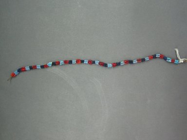 Possibly Xhosa. <em>Ornaments for Ankle or Wrists</em>, early to mid 20th century. Glass bead, natural fiber, brass, 9 1/2 in. (24.1 cm). Brooklyn Museum, Gift of Mr. and Mrs. Jerome Blum, 66.86.16a-b. Creative Commons-BY (Photo: Brooklyn Museum, CUR.66.86.16d_overall.jpg)