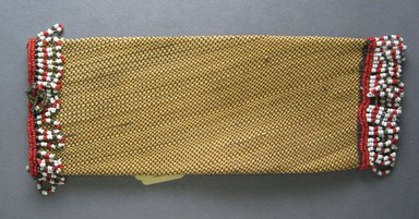 Zulu. <em>Bag or Spoon Holder (ipontshi)</em>, early 20th century. natural fiber, cotton thread, glass beads, 10 1/8 x 3 3/4 in. (25.7 x 9.5 cm). Brooklyn Museum, Gift of Mr. and Mrs. Jerome Blum, 66.86.23. Creative Commons-BY (Photo: Brooklyn Museum, CUR.66.86.23_overall..jpg)