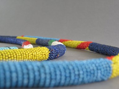 Possibly Zulu. <em>Waist Ornanment (Umbhijo)</em>, mid-20th century. Glass beads, natural fiber, cloth, 28 3/4 x 5/8 in. (73 x 1.6 cm). Brooklyn Museum, Gift of Mr. and Mrs. Jerome Blum, 66.86.5c. Creative Commons-BY (Photo: Brooklyn Museum, CUR.66.86.5a-c_detail.jpg)