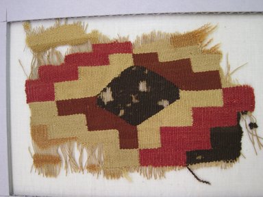 Wari. <em>Tunic, Fragment</em>, 600-1000 C.E. Cotton, camelid fiber, 4 15/16 × 3 1/2 in. (12.5 × 8.9 cm). Brooklyn Museum, Gift of Adelaide Goan, 67.159.17. Creative Commons-BY (Photo: , CUR.67.159.17_view01.jpg)